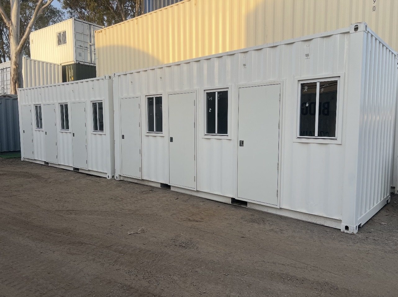 A modified shipping container home with timber deck