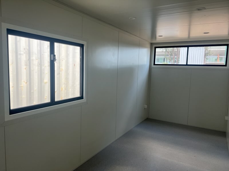 Lined and finished interior fit-out of a modified container